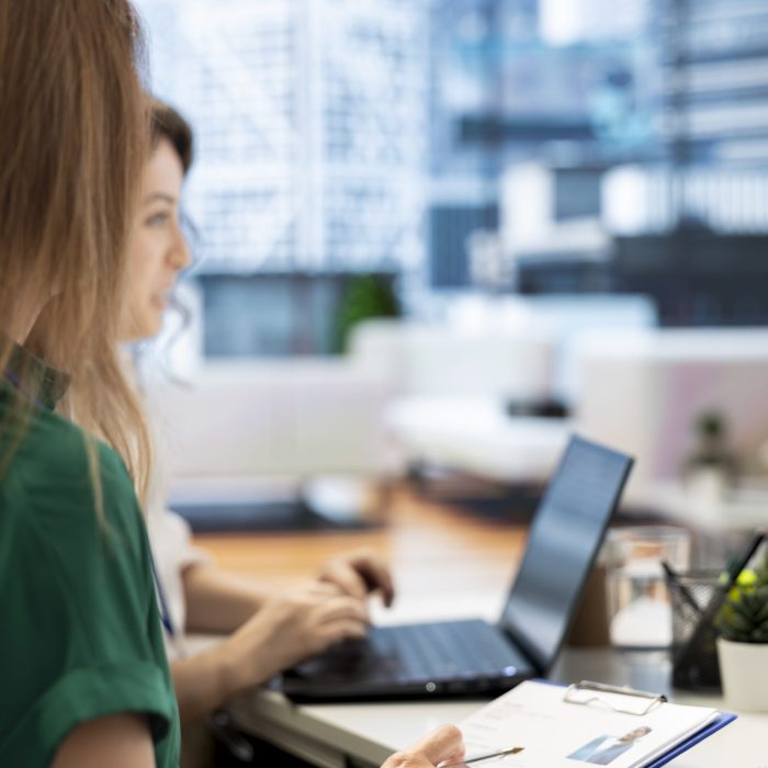 HR colleagues doing screening, determining if candidate is qualified and possesses skills and experience needed to fulfil the role. Recruiters evaluate if applicant qualifications align with company